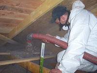 Applicateur isolation d'un toit ou de combles perdus par soufflage de laine de verre Isover